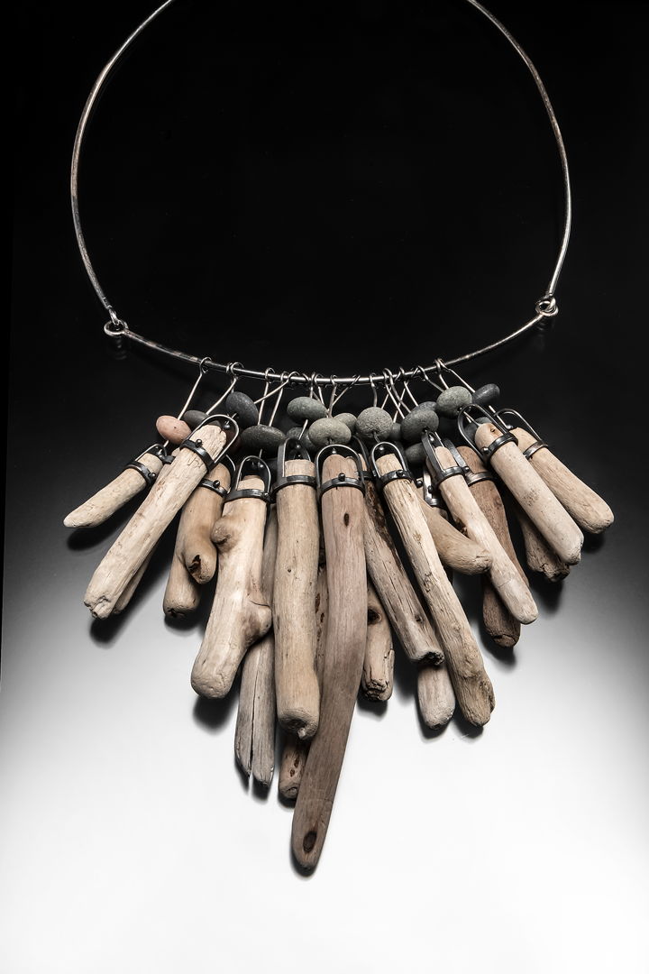 Hand fabricated sterling silver necklace with driftwood and rocks from Lake Superior