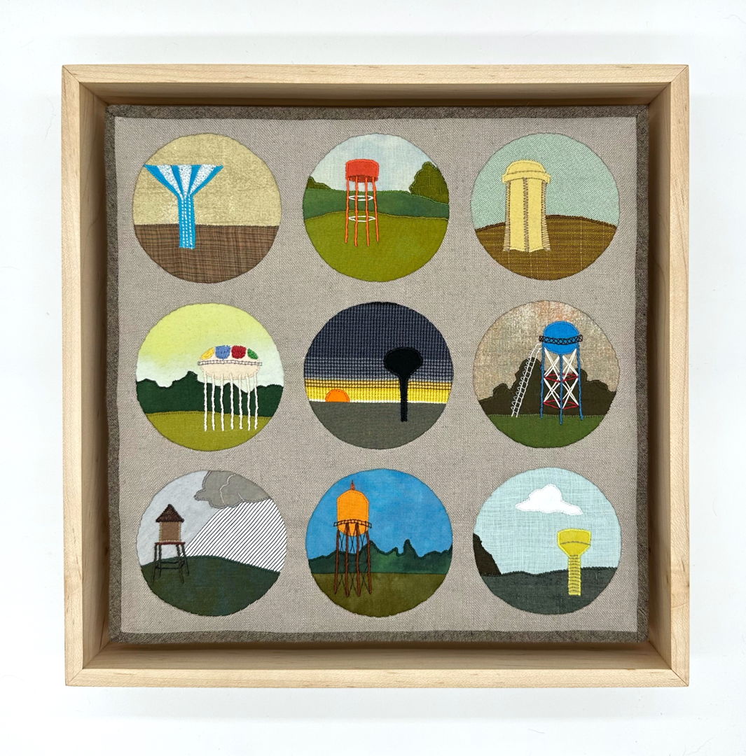 appliqued and quilted fabric depicting nine watertowers framed by circles