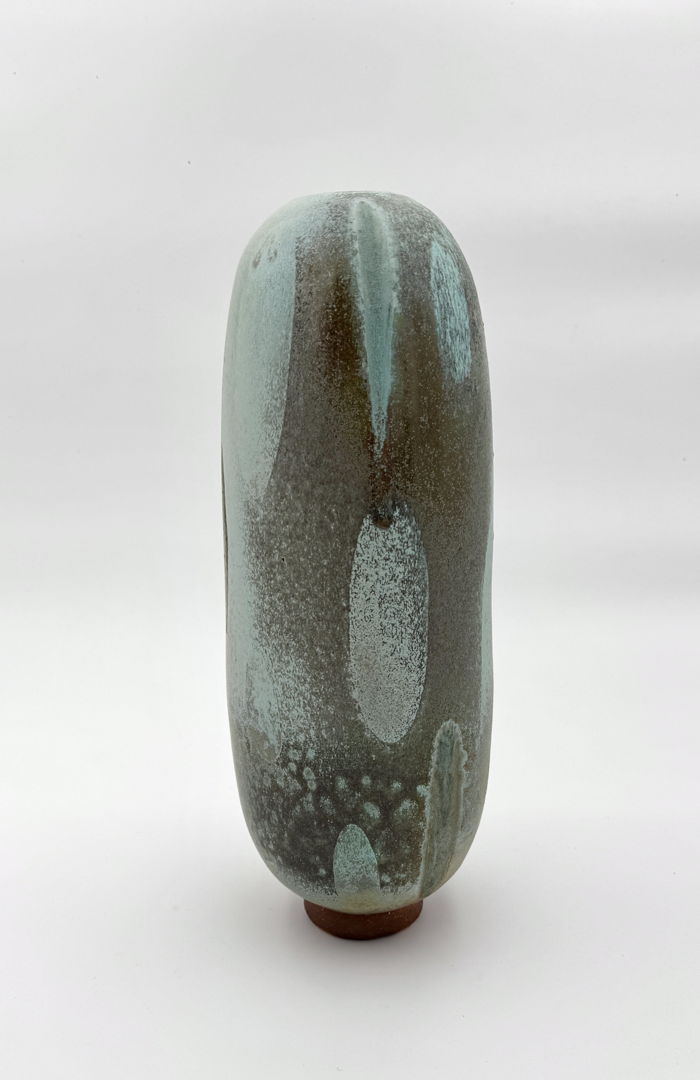 Piece based on the myth of Orpheus. Glazes include local materials collected from three rivers in Western  Ma. Glaze reacts to the rock  sand  and dirt collected making ghostlike teardrop decoration. Soda fired stoneware.