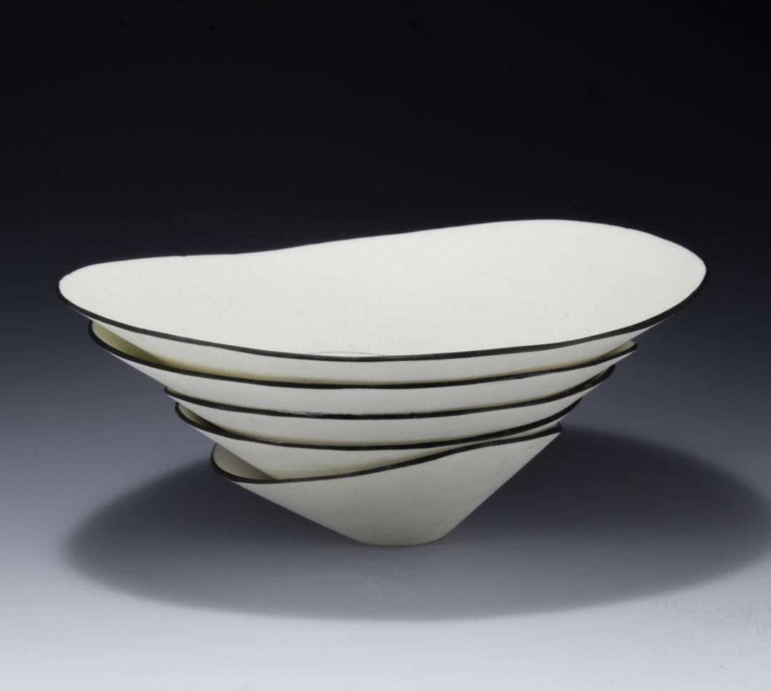 stack of porcelain bowls with black edge.