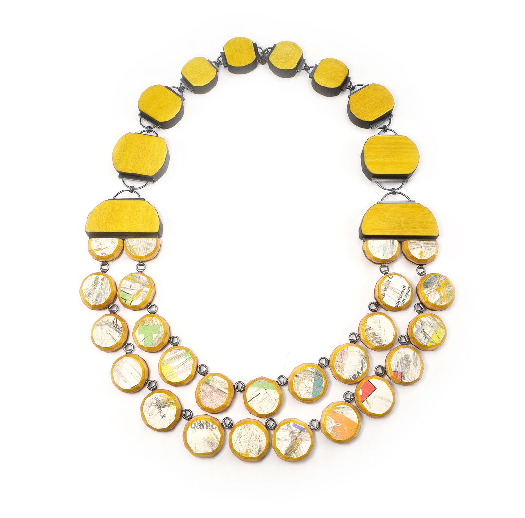 hand-cut macassar ebony and dyed maple laminate and upcycled skateboards with hand fabricated oxidized sterling silver components