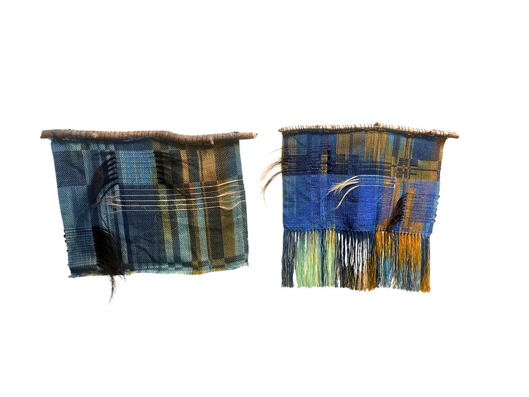 Hand dyed and hand painted tencel yarn hand woven in original deigns. Horse hair inserted in weaving and attached to sticks collected from Pine River banks in Colorado.
