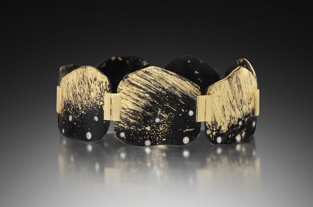 Formed and fabricated iron hinged cuff bracelet with fused surface accents of 22K Yellow Gold  seven 18K Yellow Gold hinges  and a box lock clasp. Diamonds are flush set in 18k Palladium White Gold bezels.