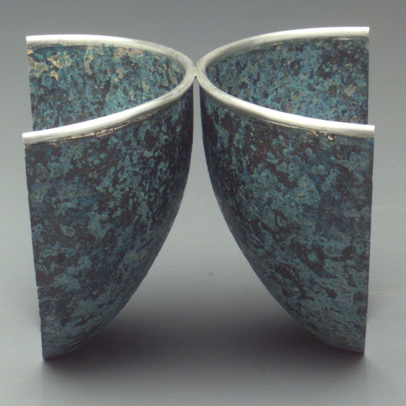 This is part if a karger collection of de-constructed bowls. Identical bowls were spun and then taken aoart and re-assembled. The purpose was to emohasize that there is "beauty" (however you describe that term) in even the most known  cliched items.