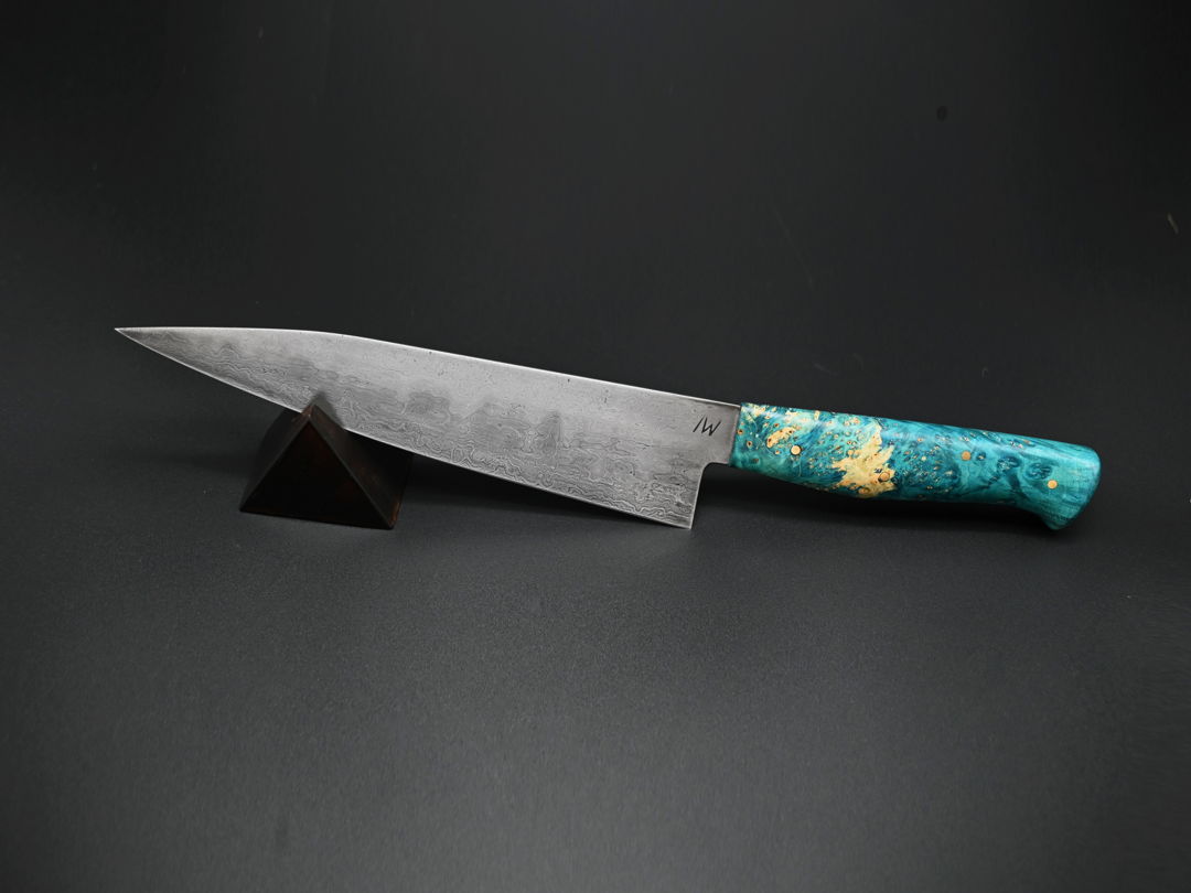Blending ancient materials and contemporary design  this chef knife sports an 8" blade handforged from folded bloomery steel and mounted in a dyed and stabilized box elder maple handle. The blade's steel was smelted from Appalachian magnetite ore in Mars  Pennsylvania.