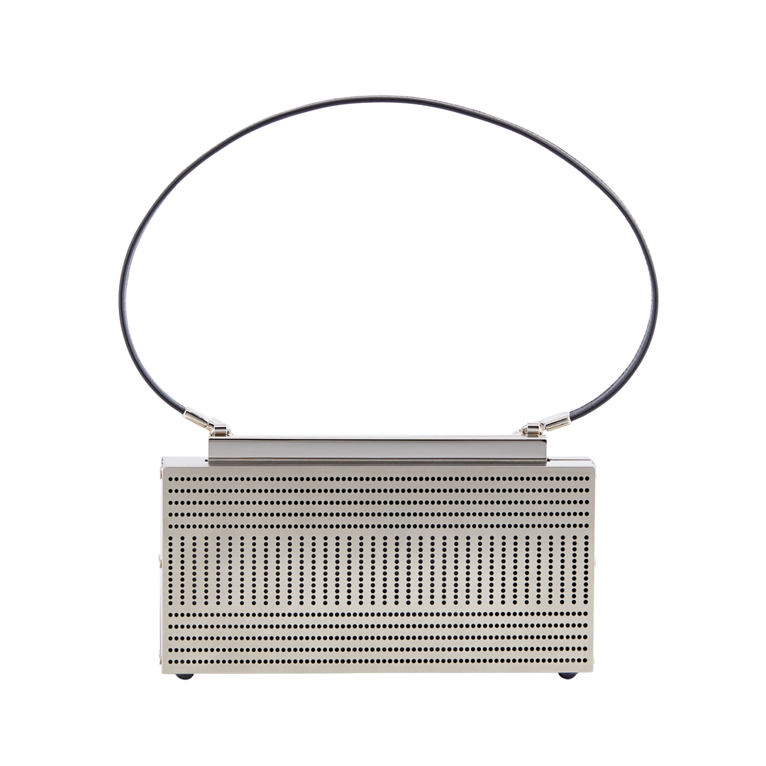 La linea bag is hand fabricated in etched stainless steel with a detachable leather strap  internal leather gussets and a magnetic closure.