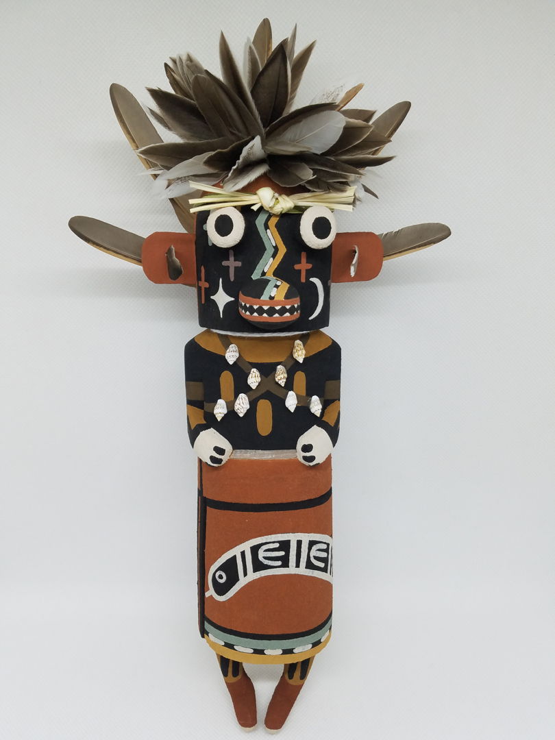 Carved from cottonwood root  painted with natural earth pigment paints. Other materials used  duck  quail feathers and yucca plant.