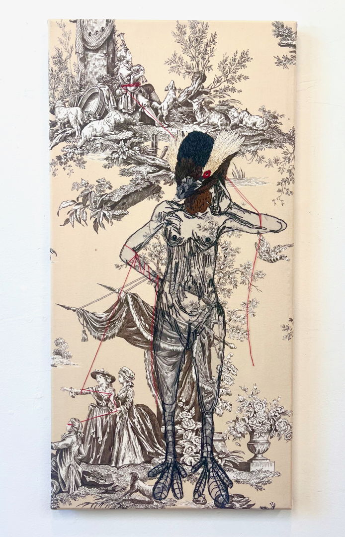 embroidered bird person on  vintage toile decor fabric.