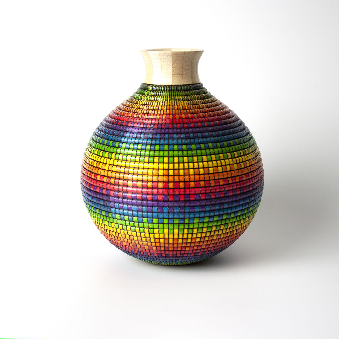 Turned and hollowed Maple vessel embellished with pyrography and hand-dyed with archival ink to give the appearance of a woven basket.