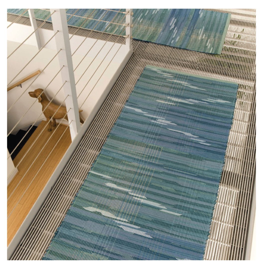 Contemporary rag rug handwoven in 100% cotton yarn and leather strips using the traditional Log Cabin Weave technique