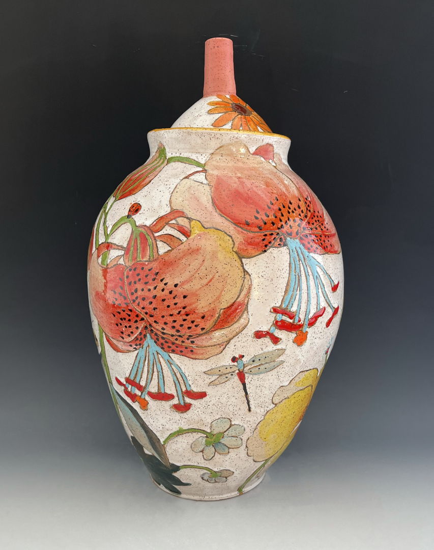 Vase made with a combination of hand-building and wheel-throwing techniques with painterly glaze and under glaze decoration of lillies.