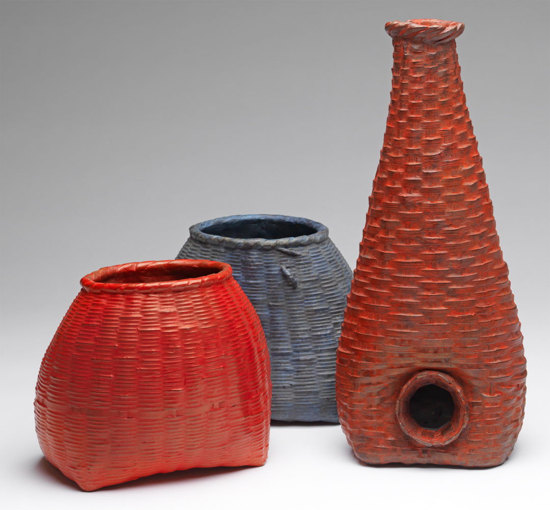 Three Cast bronze baskets with red and blue patinas.