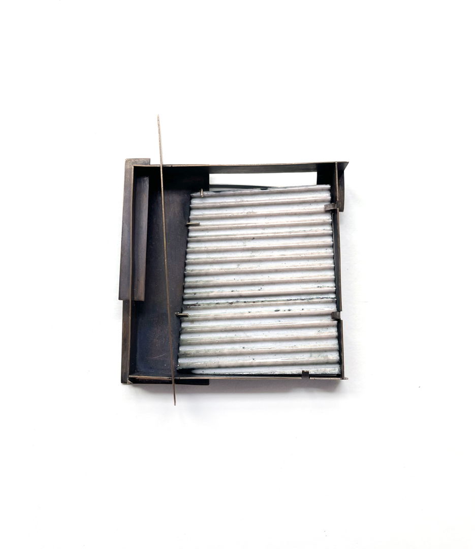 This is a one of a kind brooch  hand fabricated with bronze  enamel  14k gold  and sterling silver.