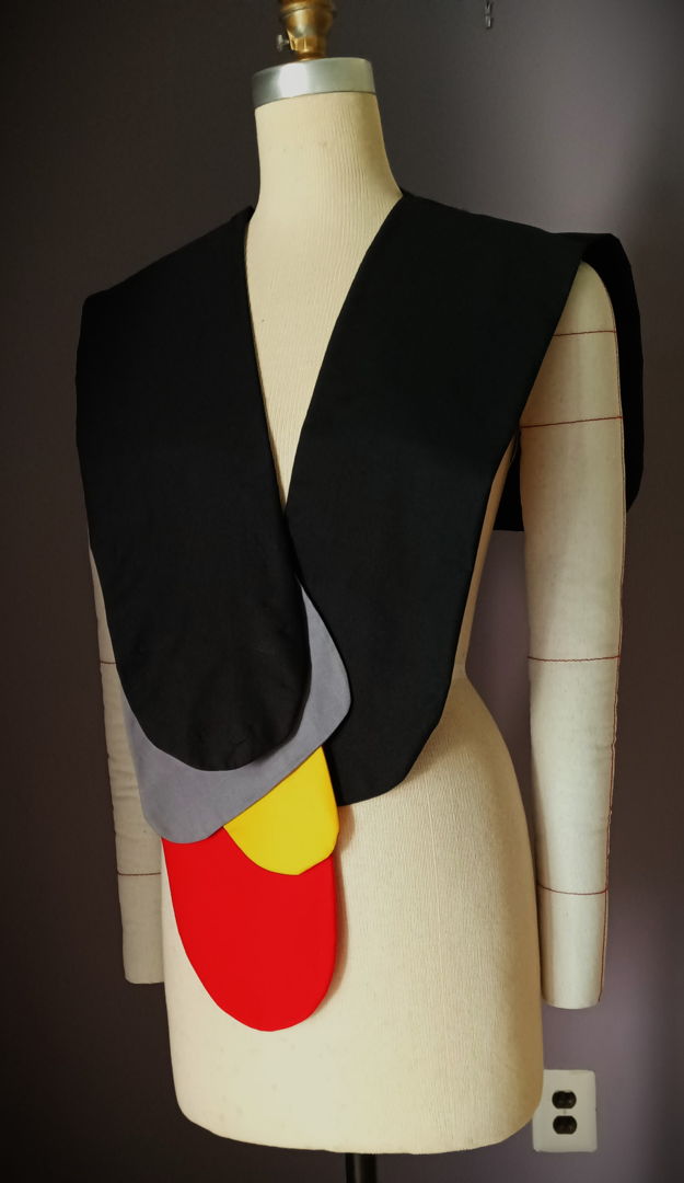 Zyra is designed for the modern wardrobe. This artisanal cotton shoulder wrap transforms craftsmanship into wearable art. Each piece is composed of layered cotton panels  shaped and stitched with precision to create an abstract play of colors that recalls the shimmer of fish scales. The design celebrates both creativity and comfort