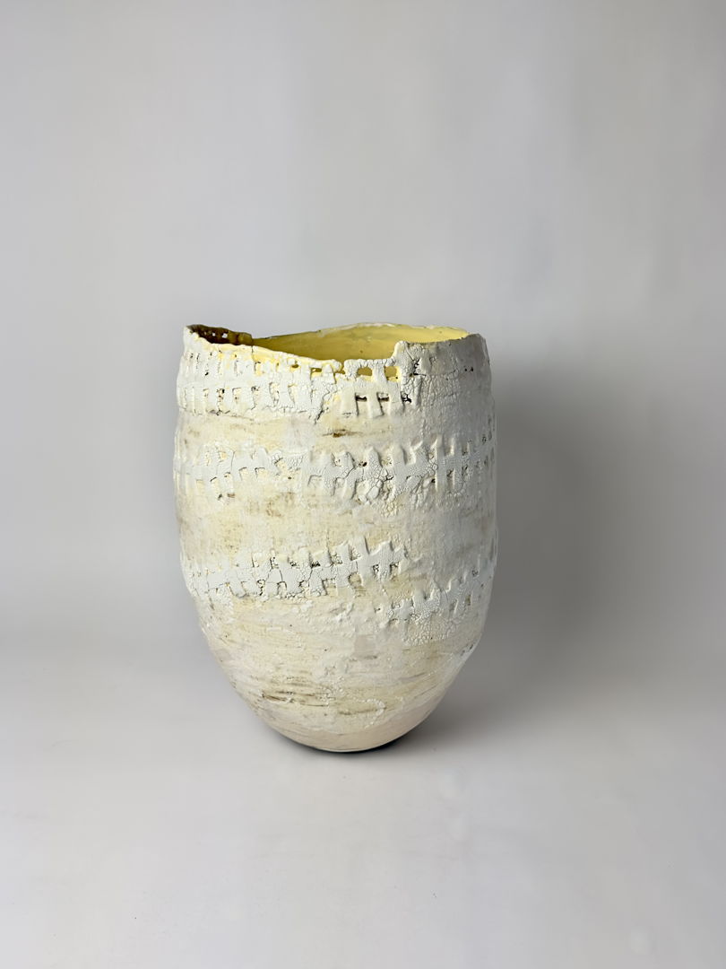 yellow and white vase with textured matte finish