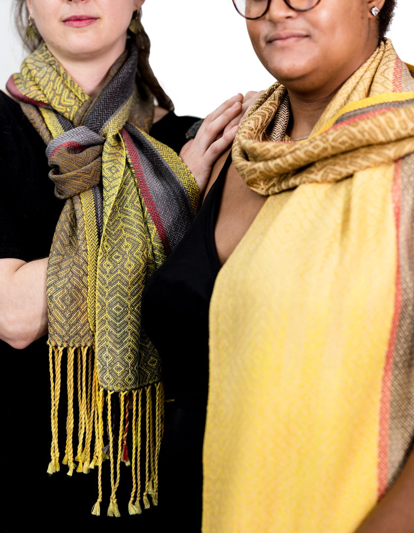 Handwoven shawl  hand painted warp and hand dyed tencel a sustainable yarn from Eucalyptus trees. Woven in original pattern on a floor loom. Colors and pattern pay homage to the Cedar Wax Wing w/asymmetrical stripes and gradient from yellow to brown.