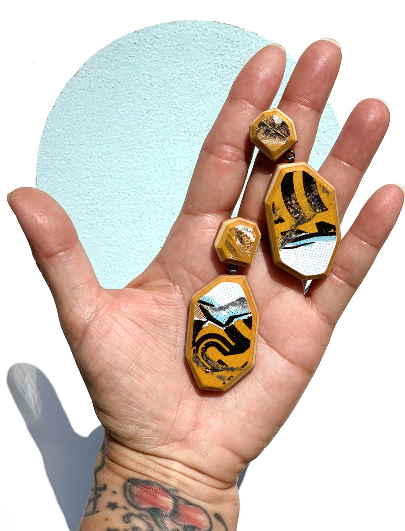 handcut upcycled skateboards with hand fabricated sterling silver findings