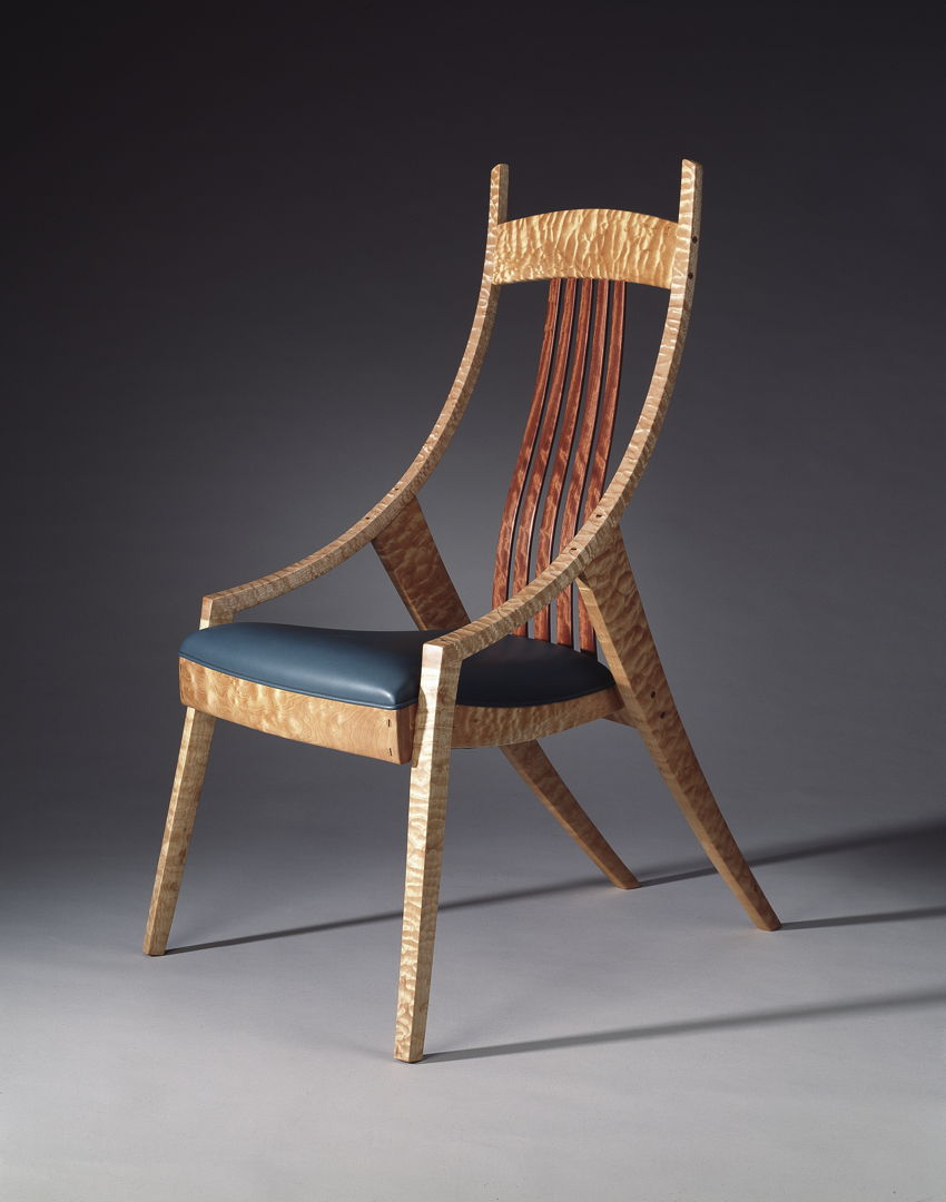 Occasional Chair with Floating Back Quilted maple with dark leather seat and back slats