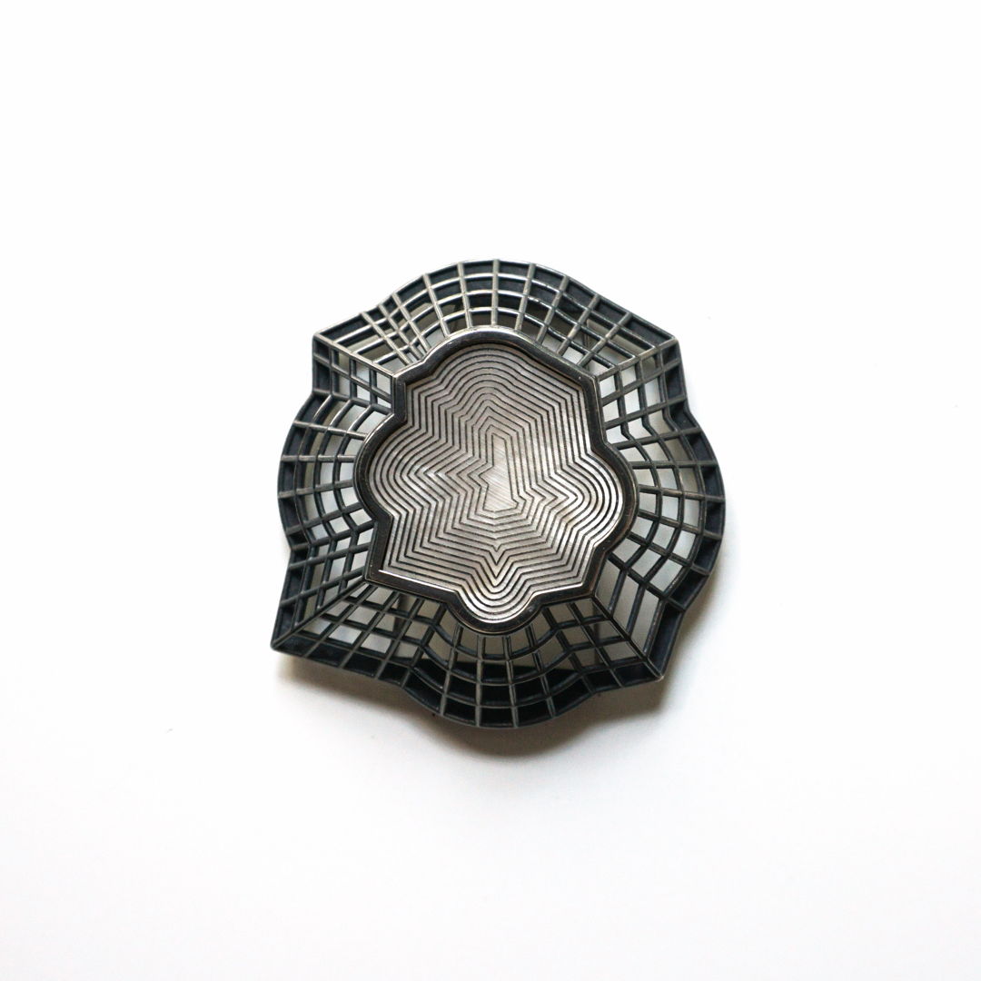 Engraved mother of pearl set in sterling silver with stainless pin back