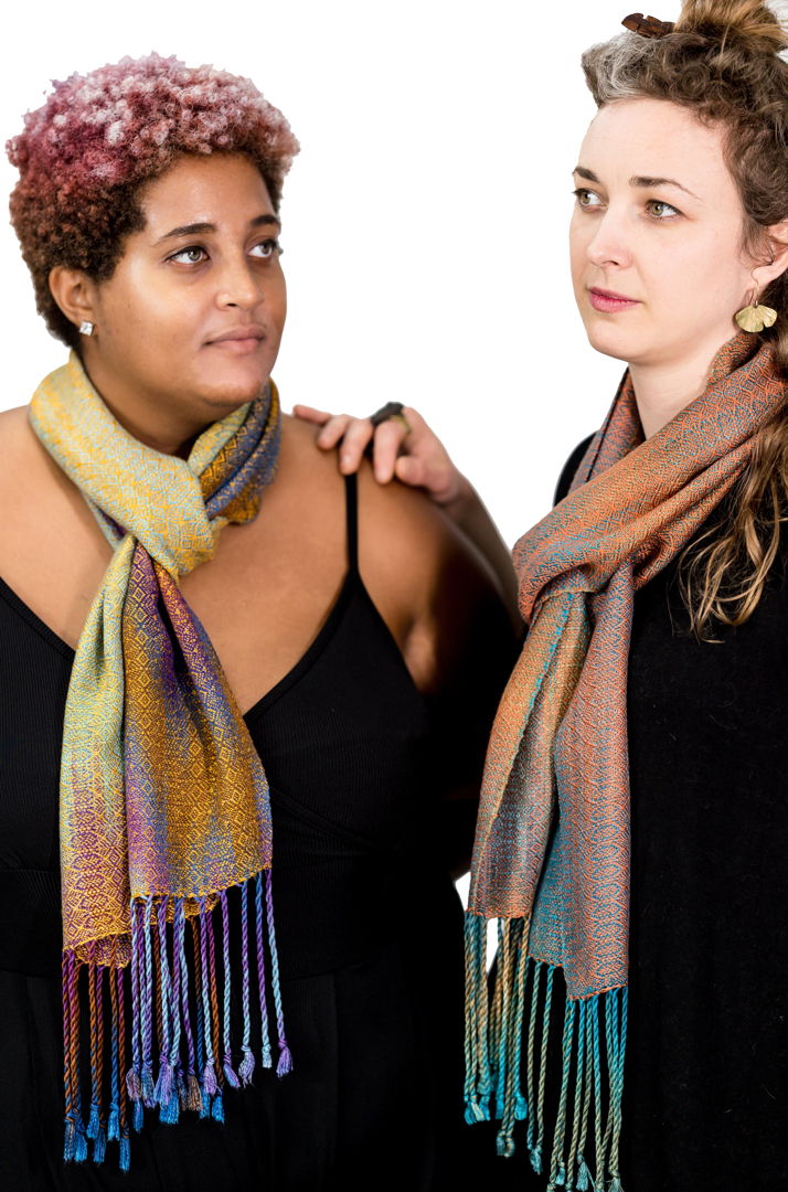 Handwoven scarves  hand painted warp and hand dyed tencel a sustainable yarn from Eucalyptus trees. Woven in original pattern on a floor loom. Colors and pattern pay homage to the Lilac breasted roller(L) and Sacred Kingfisher(R)emphasizing iridescence of yarn and patterns to mimic feathers.