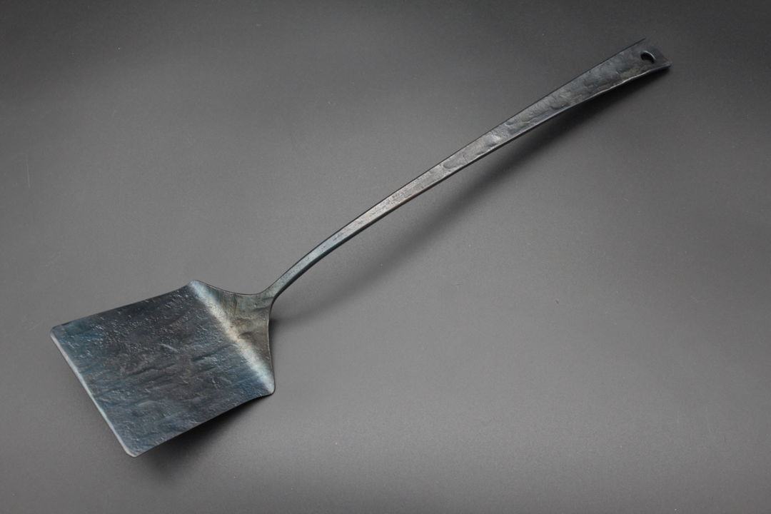 This handforged steel spatula asks  what would a medieval iron spearhead look like if it were transformed into a contemporary kitchen tool?