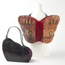 Open as backpack  in recycled vinyl billboard with upcycled conveyor belting cutoffs straps. Closed as handbag  shown in leather. Wings- if you can't earn them  buy them.