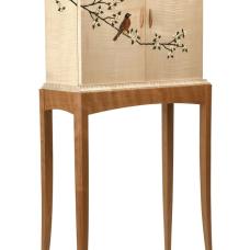 Curly maple marquetry cabinet on a cherry stand featuring cherry blossoms and a robin across the sides and doors. The veneer marquetry is all cut  shaded and assembled by hand. The interior features an adjustable cherry shelf.