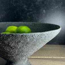 The Black Sands pedestal bowl is built from individual coils of clay and decorated with a heavily textured black slip. Specks of white can be seen throughout the rocky  crackled texture  which is inspired by Iceland’s black sand beaches. It has been sanded to a finish that begs to be touched.