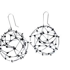 Each earring is a random pattern of hand forged links riveted together with a moveable rivet.