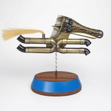 Freestanding object with removable brooch/necklace. Necklace: 19" stainless steel and sterling silver. Brooch/Pendant - 4.25 x 4.5 x 3.25". Horse spins on stand.