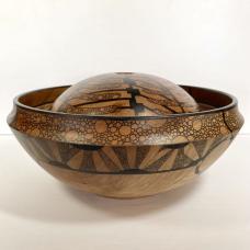 This cherry vessel has an exterior form and a different  more pregnant form inside that was hollowed out. Thedesign utilizes only archival ink to contrast the deep cherry color. Titled Nauticl  the form is held together by life preservers