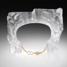 Digitally Designed Form  Hot Cast into 2 part steel mold  coldworked and laminated. Gold Fill Findings are embedded into the glass and attached to a gold fill chain for securing the piece to the arm