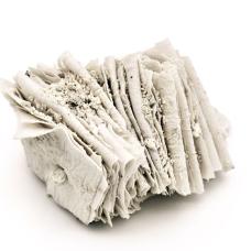 Porcelain are folded and compressed  with white clay powder packed between the layers before firing. The powder locks into the seams  preserving a soft  fossil-like texture so the form reads like a small bundle of pages or strata. A quiet study in touch  fragility  and time.