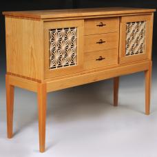 Solid cherry sideboard with hand-cut dovetailed case. Doors feature the asa-no-ha kumiko pattern in basswood backed by black Japanese paper.