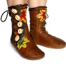 These short boots are done in a turn shoe style with leaf appliques dyed using alcohol and ink on deer hide.