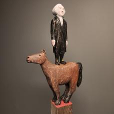 George Washington standing on a horse. Carved from reclaimed lumber.