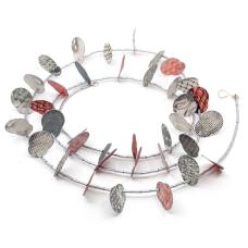 A long necklace made of washable paper (cellulose + synthetic latex) printed on an etching press with soy-based archival inks. The paper petals are strung on a steel cable with glass beads. This piece has a hand fabricated sterling silver hook clasp.