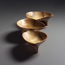 This piece is composed of three connected bowls carved from a single piece of myrtlewood.