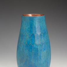 Hand-raised copper vase with chased facetted design and a vibrant teal patina