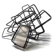 Hand made oxidized sterling silver chain is manipulated to form the three dimensional structure of line. The sandblasted mica is set within the brooch creating a focus for the relationship to light  space and shadow. (One of a Kind) 