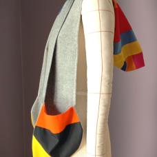 Experience the artistry of contrast in the Cromuff Cowl  grey wool drape  QUILTED cotton pockets  and a hood reimagined for modern life. Elegant  functional  unforgettable. The hood adds a sculptural element  shifting easily between function and form. More than an accessory  it’s a piece that moves with you — fluid  functional  and unmistakably yours.