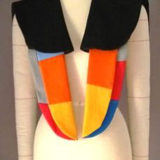 Veyna blends artistry and function  crafted from black wool and cotton with quilted wing-shaped panels. This shoulder wrap combines the richness of black wool with the softness of cotton  carefully layered into quilted  wing-inspired panels that evoke the grace of a bird in motion. Every detail is hand-finished  highlighting the artistry behind its creation and transforming fabric into a statement of wearable sculpture.