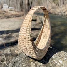 This modern take on the hen basket is all about nesting circles inside of one another. White oak frame woven with ash.