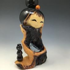 Mopani Kokeshi respectfully hold his Blackwood cat.