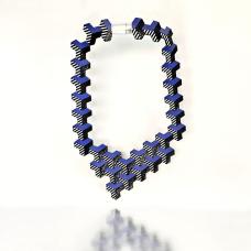 Inspired by modern architecture  this striking blue leather necklace is lightweight   comfortable and has an easy to wear magnetic clasp.