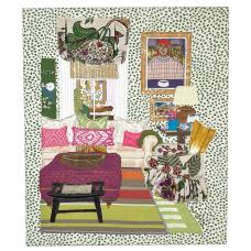 A colorful space - art-lined walls and soft seating in a room that radiates warmth and light