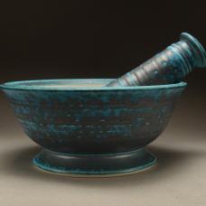 This wheel thrown mortar and pestle with a copper glaze was fired to 2400 degrees in a gas fired reduction atmosphere.