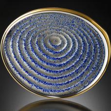 Brooch was inspired by wave patterns in water and the patterns of raked sand in Japanese gardens.