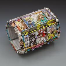 Bracelet consisting of Recycled Newspaper colorful and black and white comic strips are hand-formed into beads and hand-stitched together.