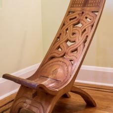 This chair is constructed and carved from a single piece of wood  and is typical of the style found in the Amazon jungle villages where I lived growing up.